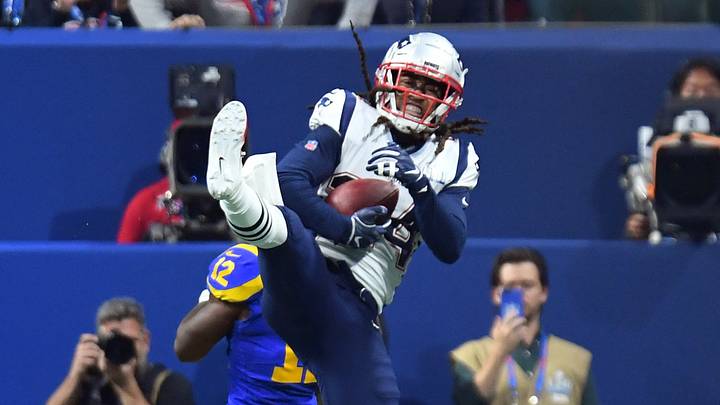 Feb 3, 2019; Atlanta, GA, USA; New England Patriots cornerback Stephon Gilmore (24) intercepts a pass intended for Los Angeles Rams wide receiver Brandin Cooks (12) during the fourth quarter in Super Bowl LIII at Mercedes-Benz Stadium. Mandatory Credit: Christopher Hanewinckel-USA TODAY Sports