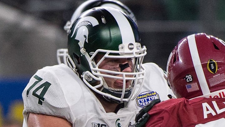 Dec 31, 2015; Arlington, TX, USA; Michigan State Spartans offensive tackle Jack Conklin (74) and Alabama Crimson Tide defensive lineman Jonathan Allen (93) during the game in the 2015  Cotton Bowl at AT&T Stadium.