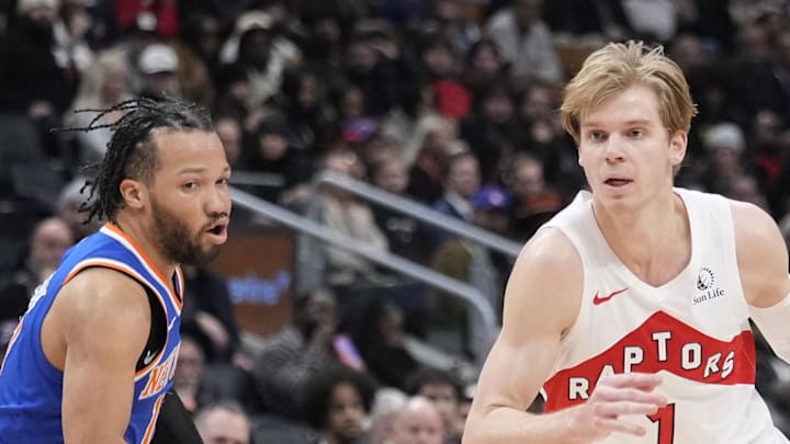 Toronto Raptors guard Gradey Dick drives to the net past New York Knicks guard Jalen Brunson.