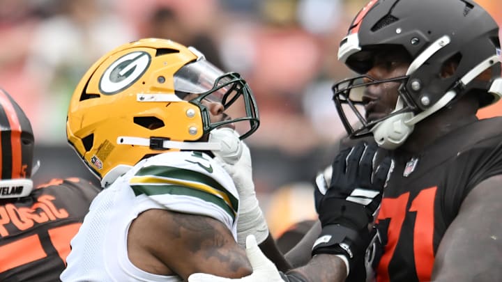 Cleveland Browns offensive tackle Cornelius Lucas (71) blocks Green Bay Packers defensive end Micah Parsons (1) on Sunday.
