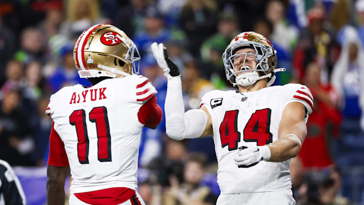 Oct 10, 2024; Seattle, Washington, USA; San Francisco 49ers fullback Kyle Juszczyk (44) celebrates with wide receiver Brandon Aiyuk (11) after rushing for a touchdown against the Seattle Seahawks at Lumen Field. Mandatory Credit: Joe Nicholson-Imagn Images