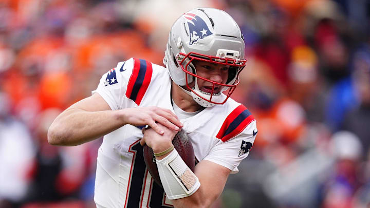 Jan 25, 2026; Denver, CO, USA; New England Patriots quarterback Drake Maye (10) rushes the ball for a touchdown against the Denver Broncos during the first half in the 2026 AFC Championship Game at Empower Field at Mile High. Mandatory Credit: Ron Chenoy-Imagn Images