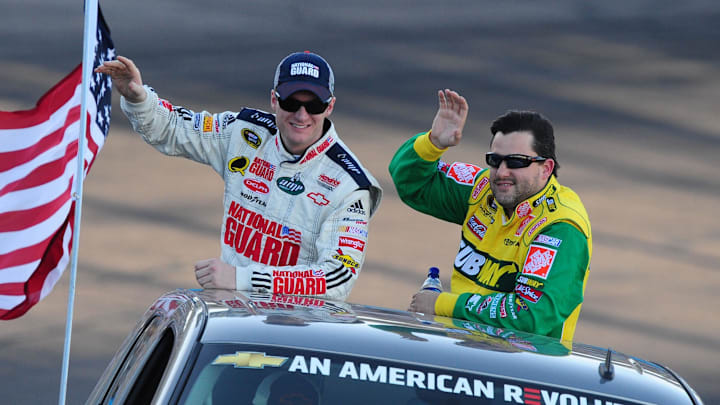 Apr 12, 2008; Avondale, AZ, USA; NASCAR Sprint Cup Series drivers Dale Earnhardt Jr (left) and Tony Stewart prior to the Subway Fresh Fit 500 at Phoenix International Raceway. Mandatory Credit: Mark J. Rebilas-Imagn Images