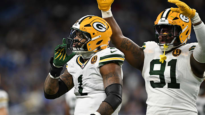 Green Bay Packers defensive end Micah Parsons (1) and Packers defensive tackle Warren Brinson celebrate vs. the Lions.