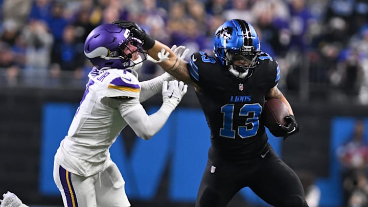 Detroit Lions running back Craig Reynolds (13) stiff arms Minnesota Vikings cornerback Byron Murphy Jr. (7) 
