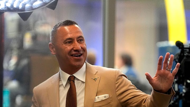 Texas head coach Steve Sarkisian waves to fans during SEC Media Days at the College Football Hall of Fame in Atlanta.
