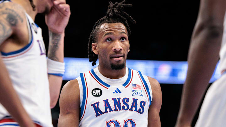 Kansas Jayhawks guard Darryn Peterson (22) talks with teammates during a timeout against the TCU Horned Frogs at T-Mobile Center. 
