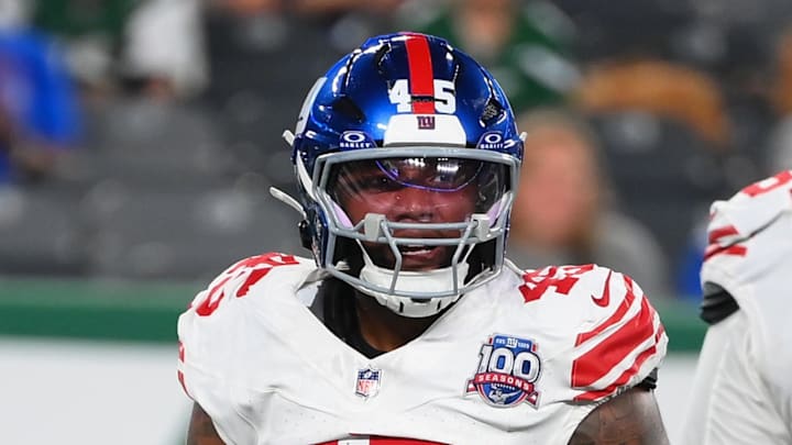 Aug 24, 2024; East Rutherford, New Jersey, USA; New York Giants linebacker Tomon Fox (45) reacts to his sack with teammate linebacker Boogie Basham (55) against the New York Jets during the first half at MetLife Stadium.  