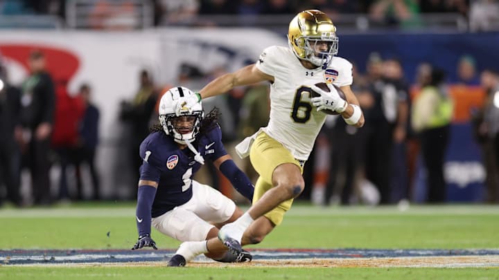 Jan 9, 2025; Miami, FL, USA; Notre Dame Fighting Irish wide receiver Jordan Faison (6) runs the ball in the first half against the Penn State Nittany Lions in the Orange Bowl at Hard Rock Stadium. Jan 9, 2025; Miami, FL, USA; Notre Dame Fighting Irish wide receiver Jordan Faison (6) runs the ball in the first half against the Penn State Nittany Lions in the Orange Bowl at Hard Rock Stadium.