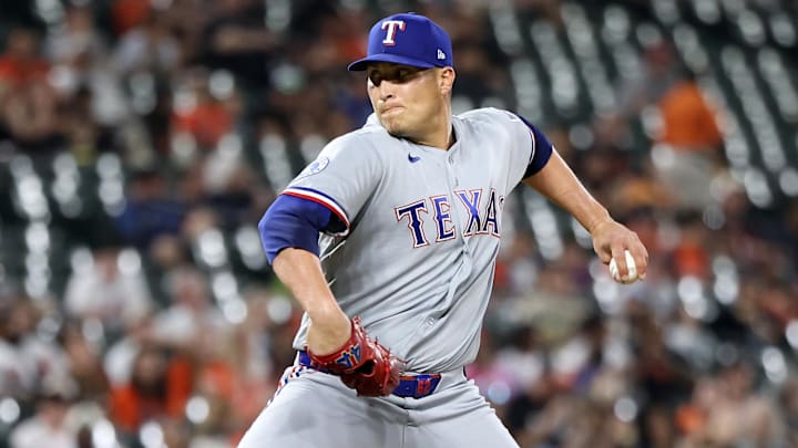 Texas Rangers pitcher Robert Garcia throws a baseball.
