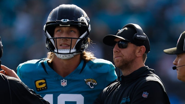 Jacksonville Jaguars quarterback Trevor Lawrence (16) and Jacksonville Jaguars head coach Liam Coen wait to see the result of a challenge during the second quarter in an NFL football AFC Wild Card playoff matchup, Sunday, Jan. 11, 2026, in Jacksonville, Fla. Bills lead 10-7 at the half over the Jaguars. [Doug Engle/Florida Times-Union]