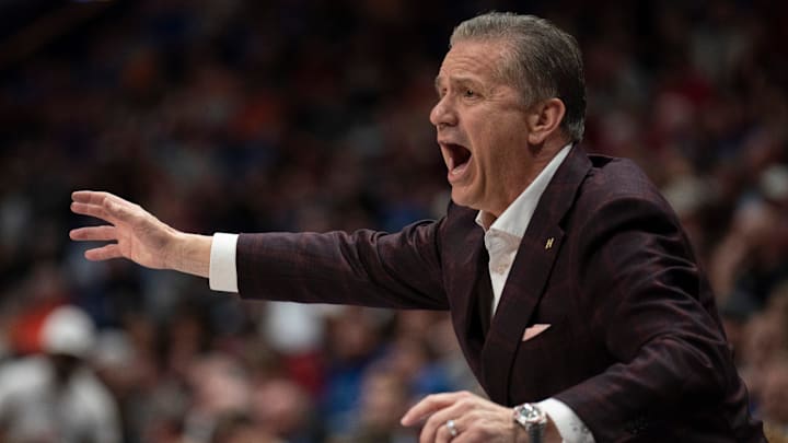 Arkansas Razorbacks coach John Calipari works the sideline against the South Carolina Gamecocks during their first round game of the SEC Men's Basketball Tournament at Bridgestone Arena in Nashville, Tenn.