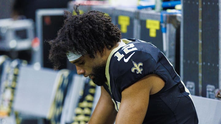 Sep 22, 2024; New Orleans, Louisiana, USA; New Orleans Saints wide receiver Chris Olave (12) reacts to a play in the final minute of the game against the Philadelphia Eagles during the second half at Caesars Superdome. Mandatory Credit: Stephen Lew-Imagn Images