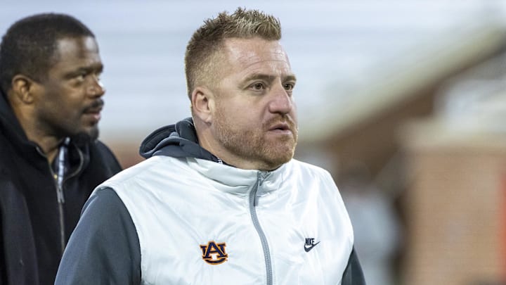 Jan 28, 2026; Mobile, AL, USA; Auburn head football coach Alex Golesh visits the field during American Senior Bowl practice at Hancock Whitney Stadium. Mandatory Credit: Vasha Hunt-Imagn Images