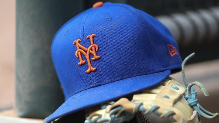 Jul 13, 2022; Atlanta, Georgia, USA; A detailed view of a New York Mets hat and glove in the dugout against the Atlanta Braves in the eighth inning at Truist Park. Jul 13, 2022; Atlanta, Georgia, USA; A detailed view of a New York Mets hat and glove in the dugout against the Atlanta Braves in the eighth inning at Truist Park.