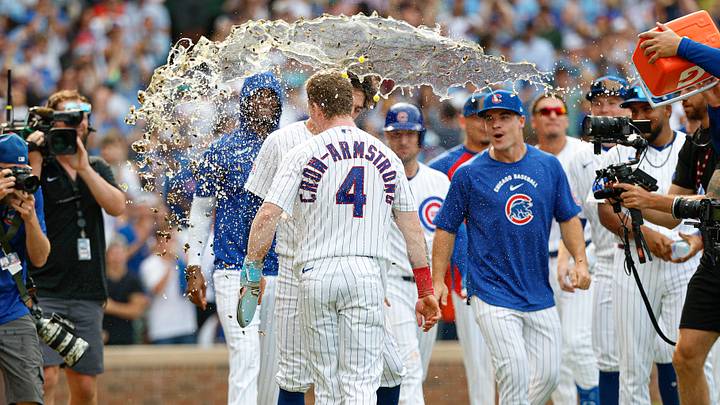 Aug 6, 2026; Chicago, Illinois, USA; Chicago Cubs designated hitter Pete Crow-Armstrong (4) celebrates with teammates after scoring a game winning run against the Toronto Blue Jays during the 11th inning at Wrigley Field. Mandatory Credit: Kamil Krzaczynski-Imagn Images