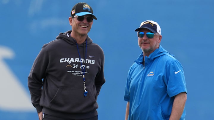 May 12, 2025; El Segundo, CA, USA; Los Angeles Chargers coach Jim Harbaugh (left) and general manager Joe Hortiz watch during offseason workouts at The Bolt. Mandatory Credit: Kirby Lee-Imagn Images