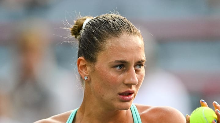Marta Kostyuk serves the ball