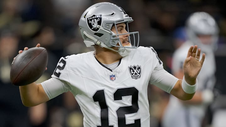 Dec 29, 2024; New Orleans, Louisiana, USA; Las Vegas Raiders quarterback Aidan O'Connell (12) throws against the New Orleans Saints during the first half at Caesars Superdome. Mandatory Credit: Matthew Hinton-Imagn Images