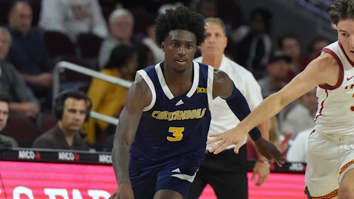 Nov 4, 2024; Los Angeles, California, USA; Chattanooga Mocs guard Honor Huff (3) dribbles the ball against Southern California Trojans guard Clark Slajchert (32) in the second half at Galen Center. Mandatory Credit: Kirby Lee-Imagn Images Nov 4, 2024; Los Angeles, California, USA; Chattanooga Mocs guard Honor Huff (3) dribbles the ball against Southern California Trojans guard Clark Slajchert (32) in the second half at Galen Center. Mandatory Credit: Kirby Lee-Imagn Images