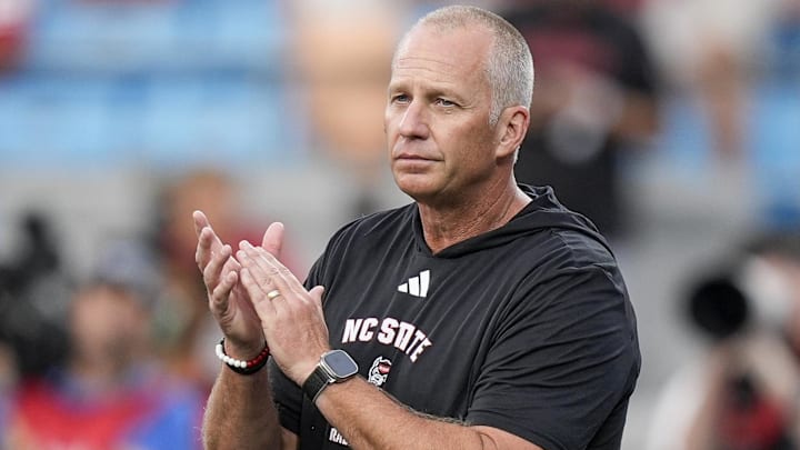 Sep 7, 2024; Charlotte, North Carolina, USA; North Carolina State Wolfpack head coach Dave Doeren during pregame activities against the Tennessee Volunteers at the Dukes Mayo Classic at Bank of America Stadium. Mandatory Credit: Jim Dedmon-Imagn Images