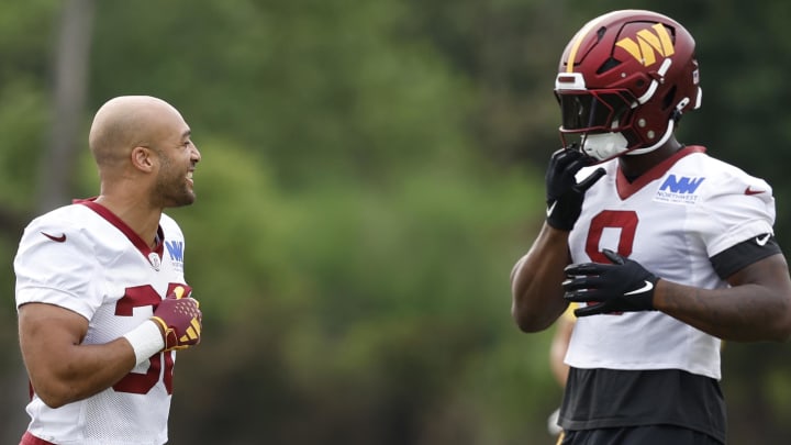 Jul 25, 2024; Ashburn, VA, USA; Washington Commanders running back Austin Ekeler (30) jokes with Washington Commanders running back Brian Robinson Jr. (8) on day two of training camp at OrthoVirginia Training Center at Commanders Park. Mandatory Credit: Geoff Burke-USA TODAY Sports Jul 25, 2024; Ashburn, VA, USA; Washington Commanders running back Austin Ekeler (30) jokes with Washington Commanders running back Brian Robinson Jr. (8) on day two of training camp at OrthoVirginia Training Center at Commanders Park. Mandatory Credit: Geoff Burke-USA TODAY Sports