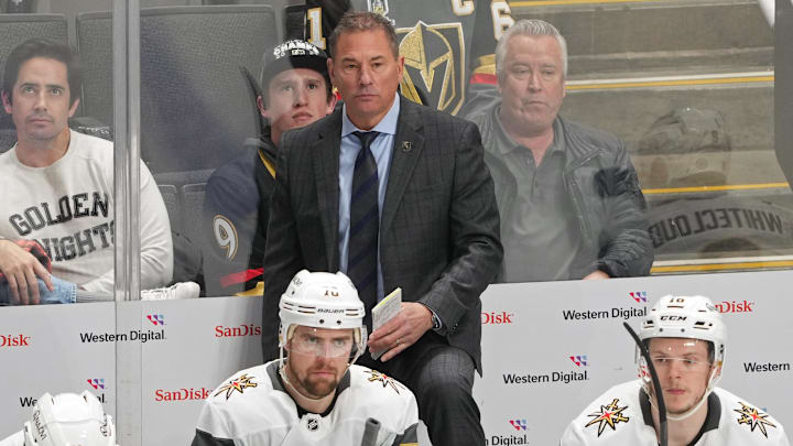 Jan 7, 2025; San Jose, California, USA; Vegas Golden Knights head coach Bruce Cassidy (center back) stands behind the bench during the third period against the San Jose Sharks at SAP Center at San Jose. Mandatory Credit: Darren Yamashita-Imagn Images