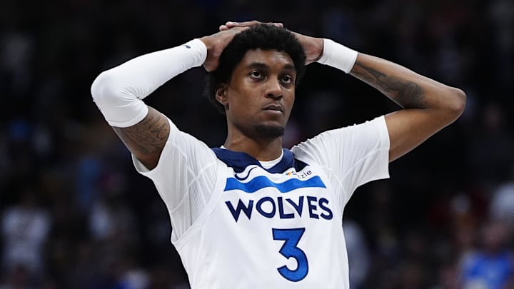 Dec 25, 2025; Denver, Colorado, USA; Minnesota Timberwolves forward Jaden McDaniels (3) reacts to a flagrant foul called in overtime against the Denver Nuggets at Ball Arena. Mandatory Credit: Ron Chenoy-Imagn Images