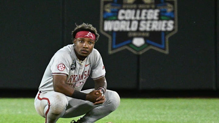 Jun 18, 2025; Omaha, Neb, USA;  Arkansas Razorbacks center fielder Justin Thomas Jr. (4) bows his head after the loss against the LSU Tigers at Charles Schwab Field. Mandatory Credit: Steven Branscombe-Imagn Images