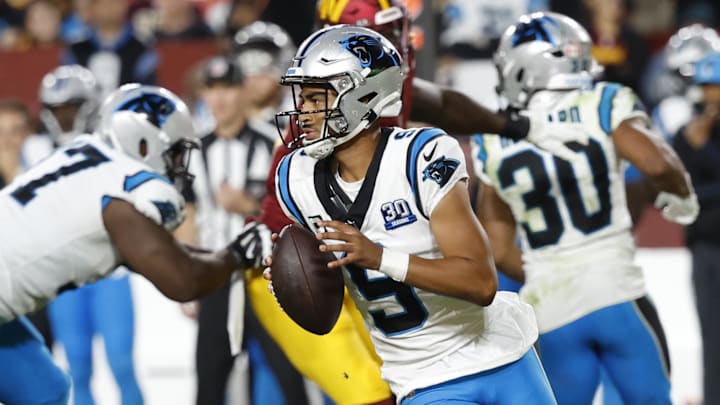 Oct 20, 2024; Landover, Maryland, USA; Carolina Panthers quarterback Bryce Young (9) scrambles against the Washington Commanders during the fourth quarter at Northwest Stadium. Mandatory Credit: Geoff Burke-Imagn Images