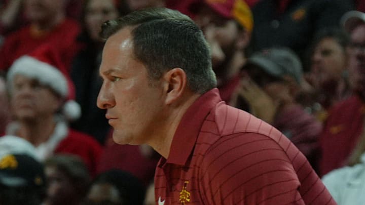 Iowa State Cyclones men's basketball head coach T.J. Otzelberger watches from bench against Iowa during the first half in the men’s basketball Cy-Hawk series on Dec. 11, 2025, in Ames, Iowa. Iowa State Cyclones men's basketball head coach T.J. Otzelberger watches from bench against Iowa during the first half in the men’s basketball Cy-Hawk series on Dec. 11, 2025, in Ames, Iowa.