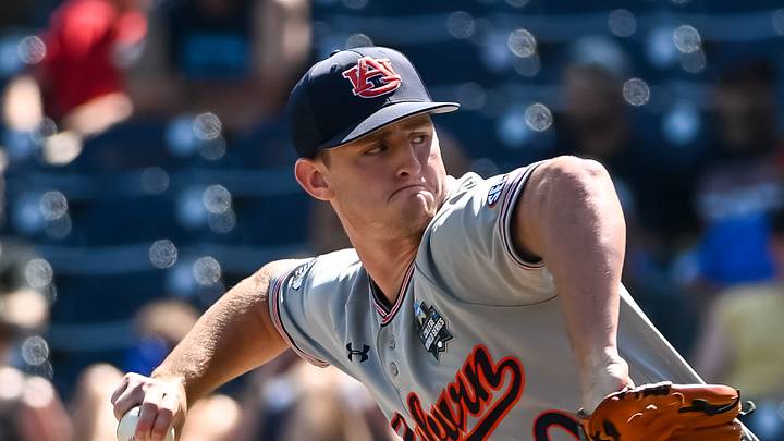 Jun 20, 2022; Omaha, NE, USA;  Auburn Tigers pitcher Blake Burkhalter (40) pitches against the Stanford Cardinal in the ninth inning at Charles Schwab Field. Mandatory Credit: Steven Branscombe-USA TODAY Sports
