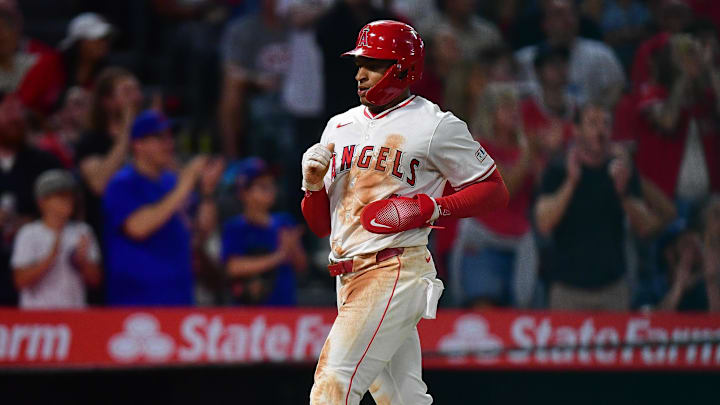 Sep 26, 2025; Anaheim, California, USA; Los Angeles Angels second baseman Christian Moore (4) scores a run against the Houston Astros during the fifth inning at Angel Stadium. Mandatory Credit: Gary A. Vasquez-Imagn Images