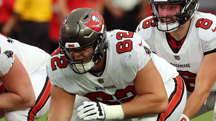 Aug 23, 2024; Tampa, Florida, USA; Tampa Bay Buccaneers center Graham Barton (62) hikes the ball to Tampa Bay Buccaneer quarterback Baker Mayfield (6) against the Miami Dolphins  during the first quarter at Raymond James Stadium. Mandatory Credit: Kim Klement Neitzel-Imagn Images