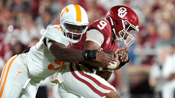 Oklahoma Sooners quarterback Michael Hawkins Jr. (9) is brought down by Tennessee Volunteers defensive lineman Jayson Jenkins (97) during a college football game between the University of Oklahoma Sooners (OU) and the Tennessee Volunteers at Gaylord Family - Oklahoma Memorial Stadium in Norman, Okla., Saturday, Sept. 21, 2024.