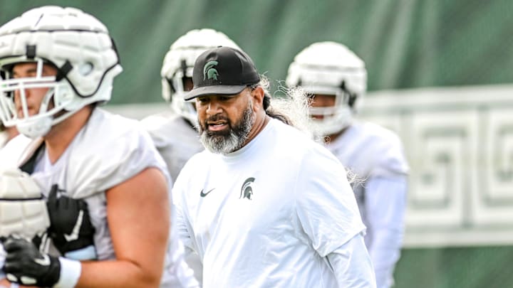 Michigan State's defensive line coach Legi Suiaunoa works with players during the first day of football camp on Tuesday, July 30, 2024, in East Lansing. Michigan State's defensive line coach Legi Suiaunoa works with players during the first day of football camp on Tuesday, July 30, 2024, in East Lansing.