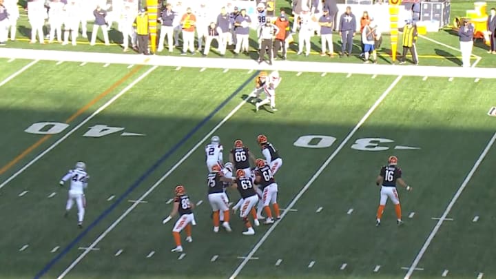New England Patriots cornerback Marcus Jones intercepts a pass from Cincinnati Bengals quarterback Joe Flacco and returns it for a touchdown.