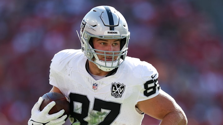 Dec 8, 2024; Tampa, Florida, USA; Las Vegas Raiders tight end Michael Mayer (87) runs with the ball against the Tampa Bay Buccaneers in the second quarter at Raymond James Stadium. Mandatory Credit: Nathan Ray Seebeck-Imagn Images