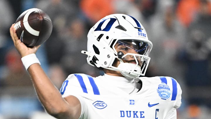 Dec 6, 2025; Charlotte, NC, USA; Duke Blue Devils quarterback Darian Mensah (10) throws in the second quarter against the Virginia Cavaliers during the 2025 ACC Championship game at Bank of America Stadium. Mandatory Credit: Bob Donnan-Imagn Images