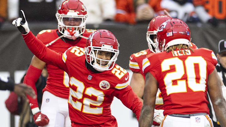 Dec 15, 2024; Cleveland, Ohio, USA; Kansas City Chiefs cornerback Trent McDuffie (22) celebrates his interception against the Cleveland Browns in the end zone during the fourth quarter at Huntington Bank Field. Mandatory Credit: Scott Galvin-Imagn Images