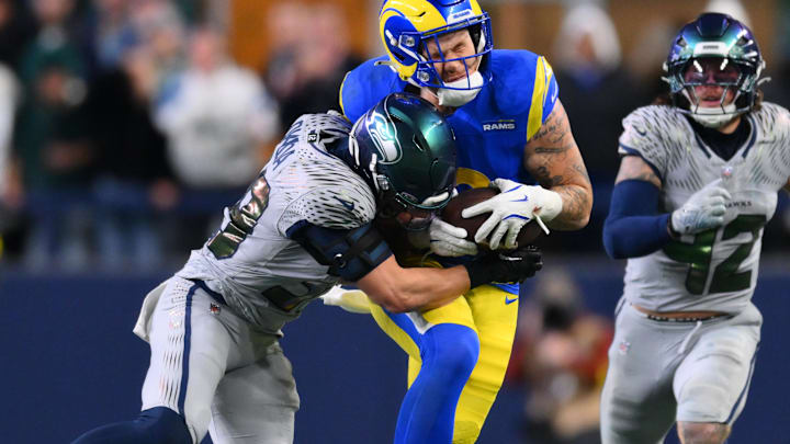 Dec 18, 2025; Seattle, Washington, USA; Seattle Seahawks safety Ty Okada (39) tackles Los Angeles Rams tight end Terrance Ferguson (18) in the second half at Lumen Field. Mandatory Credit: Steven Bisig-Imagn Images Dec 18, 2025; Seattle, Washington, USA; Seattle Seahawks safety Ty Okada (39) tackles Los Angeles Rams tight end Terrance Ferguson (18) in the second half at Lumen Field. Mandatory Credit: Steven Bisig-Imagn Images