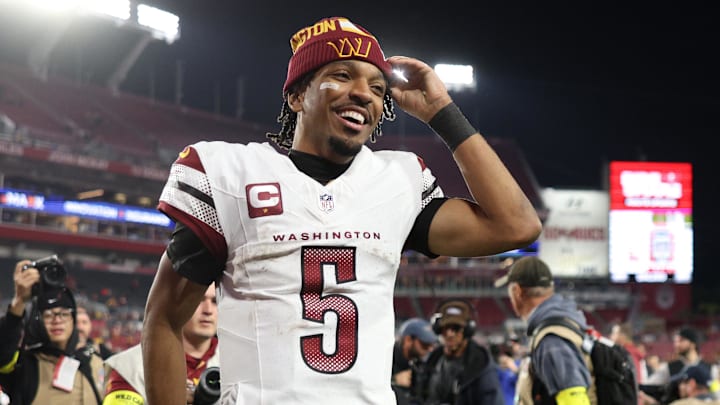 Jan 12, 2025; Tampa, Florida, USA; Washington Commanders quarterback Jayden Daniels (5) celebrates after winning a NFC wild card playoff against the Tampa Bay Buccaneers at Raymond James Stadium. Mandatory Credit: Nathan Ray Seebeck-Imagn Images