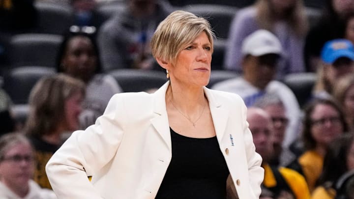 Iowa Hawkeyes head coach Jan Jensen watches the game from the sidelines Sunday, March 8, 2026, during the Big Ten Tournament Championship game at Gainbridge Fieldhouse in Indianapolis. UCLA Bruins defeated the Iowa Hawkeyes, 96-45, for back to back Big Ten championships.