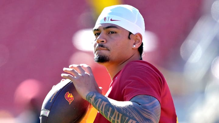 Oct 11, 2025; Los Angeles, California, USA;  USC Trojans quarterback Jayden Maiava (14) warms up prior to the game against the Michigan Wolverines at United Airlines Field at the Los Angeles Memorial Coliseum. Mandatory Credit: Jayne Kamin-Oncea-Imagn Images