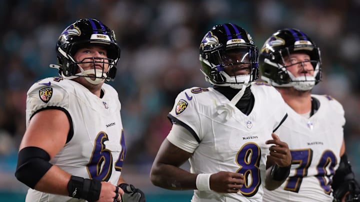 Oct 30, 2025; Miami Gardens, Florida, USA; Baltimore Ravens quarterback Lamar Jackson (8) runs up to the line with center Tyler Linderbaum (64) and offensive tackle Roger Rosengarten (70) during the third quarter against the Miami Dolphins at Hard Rock Stadium. Mandatory Credit: Sam Navarro-Imagn Images