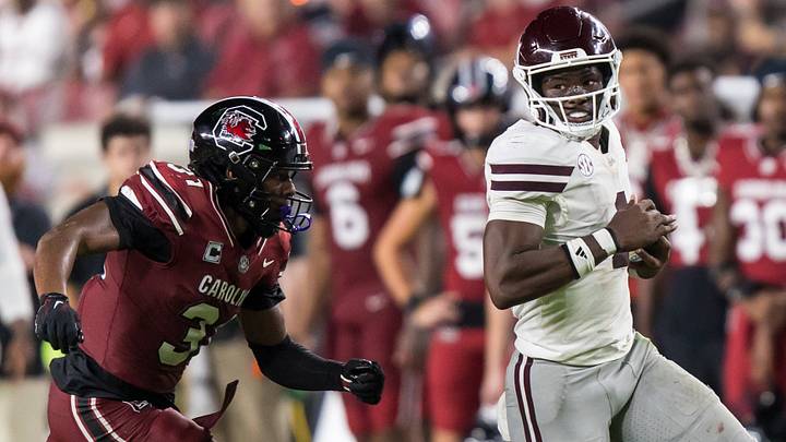 Mississippi State Bulldogs quarterback Kamario Taylor (1) scrambles past South Carolina Gamecocks defensive back Kelvin Hunter (3) in the second half at Williams-Brice Stadium. Mississippi State Bulldogs quarterback Kamario Taylor (1) scrambles past South Carolina Gamecocks defensive back Kelvin Hunter (3) in the second half at Williams-Brice Stadium.
