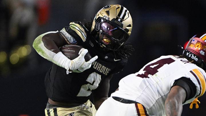 Purdue Boilermakers running back Fame Ijeboi (2) jukes Minnesota Golden Gophers defensive back Zack Harden (4). Purdue Boilermakers running back Fame Ijeboi (2) jukes Minnesota Golden Gophers defensive back Zack Harden (4).