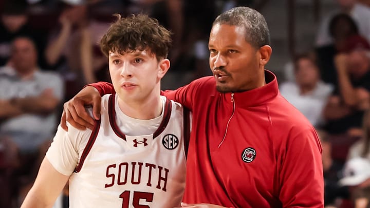 South Carolina Gamecocks head coach Lamont Paris speaks with guard Eli Ellis (15) against the Georgia Bulldogs in the first half at Colonial Life Arena.