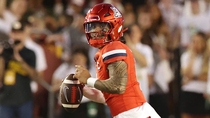 Sep 27, 2025; Ames, Iowa, USA; Arizona Wildcats quarterback Noah Fifita (1) looks to pass against the Iowa State Cyclones during the first half at Jack Trice Stadium. Mandatory Credit: Reese Strickland-Imagn Images