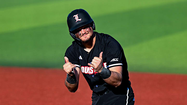 Louisville first baseman Tague Davis celebrates after getting on base against Central Michigan. Louisville first baseman Tague Davis celebrates after getting on base against Central Michigan.